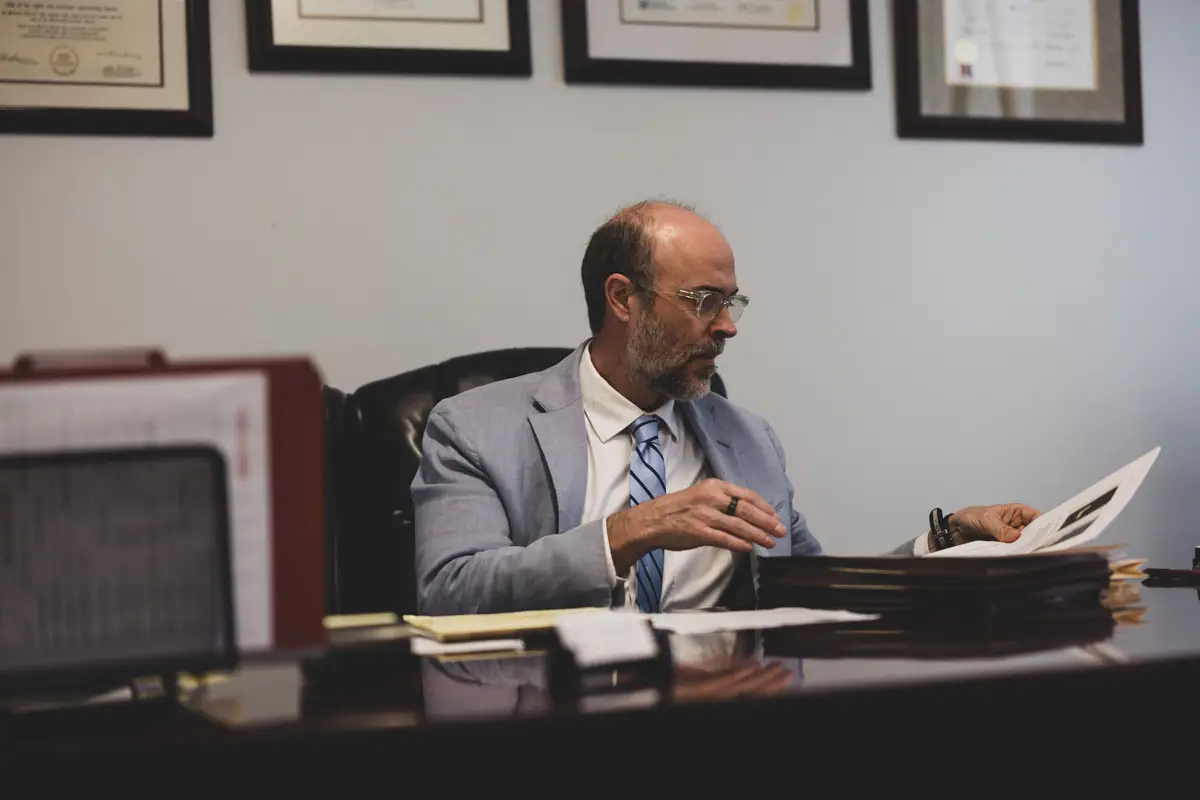 Leslie LeGrand working at his desk in his Houston office